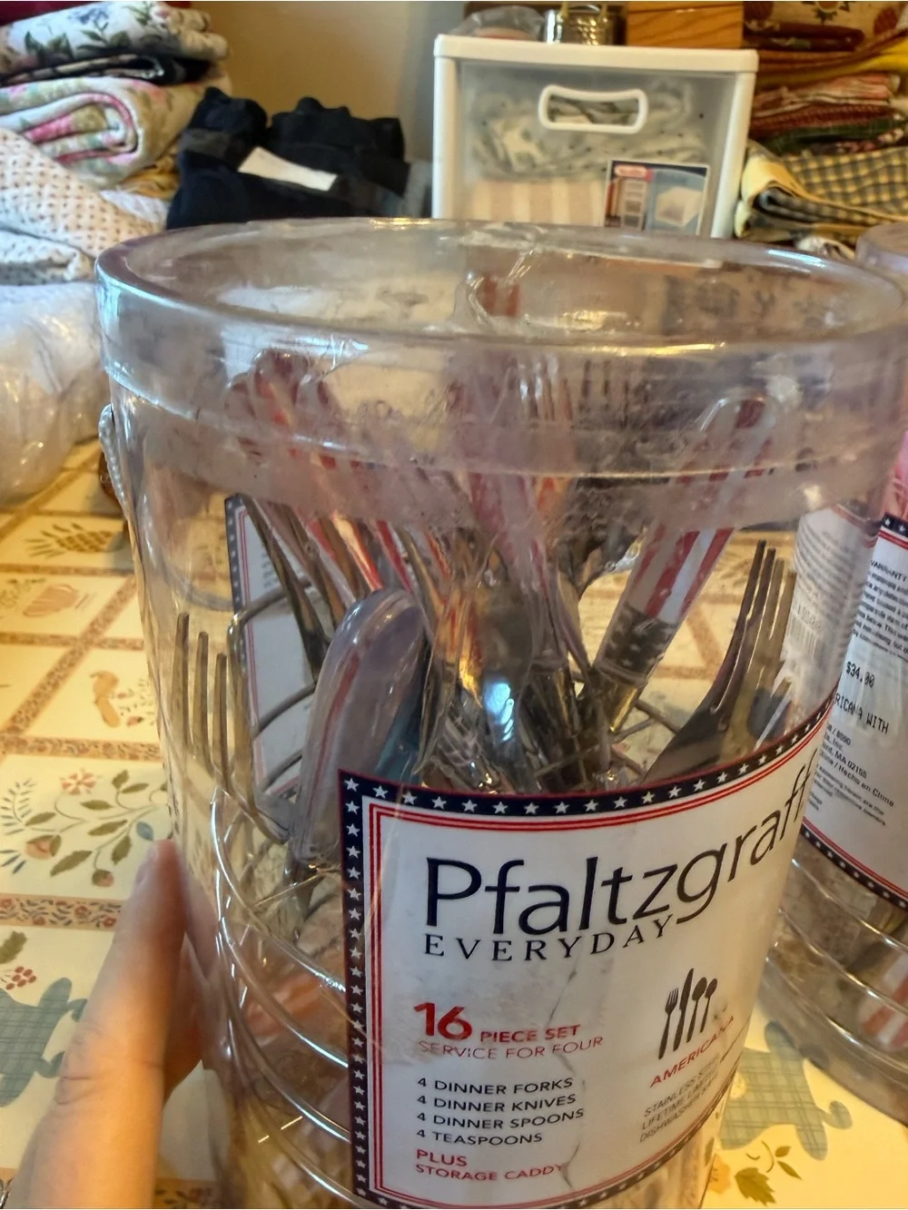 Two unopened packages of Pfaltzgraff Everyday Americana 16-piece flatware sets